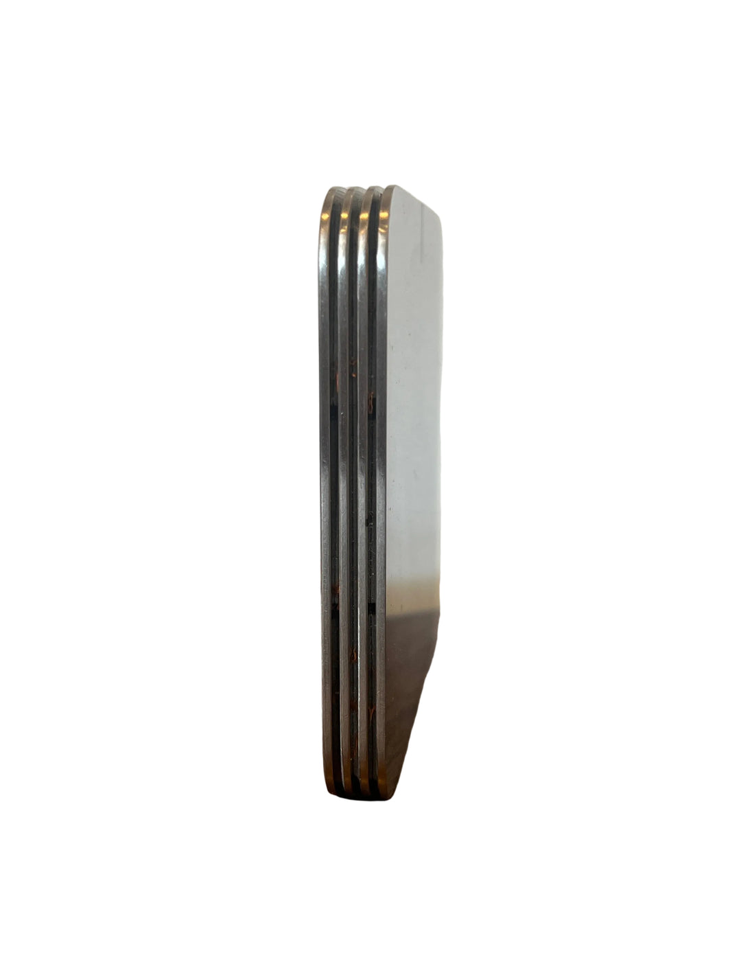Stack of metal files on a wooden surface with a white background